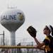 Chelsea pitcher Rylee Rosentreter catch a ball with a Saline Water tower in the background on Monday, April 29. Daniel Brenner I AnnArbor.com